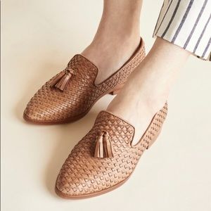 Classic stylish tan woven Nisolo Frida loafers with tassels